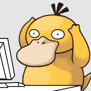 The Pokémon Psyduck, a yellow cartoonish duck with wide-open eyes. It has its hands on its forehead. It's in front of a computer screen.